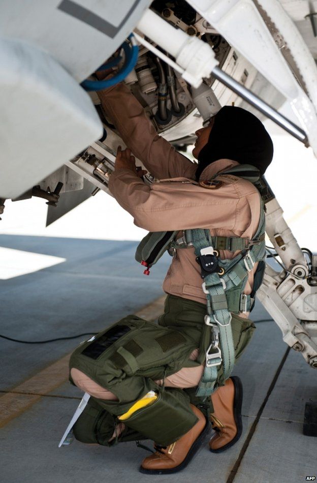 Major Mariam al-Mansouri checks her F-16 jet, in an image from 13 June