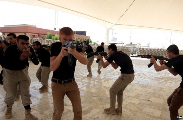 Shia Muslim men receive military training at Karbala, Iraq, 27 September