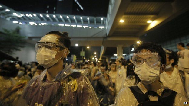 Protesters wearing masks and goggles gather outside the government headquarter in Hong Kong, on 28 September 2014.