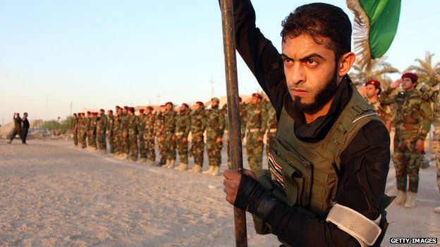 Members of the Shia Muslim Mehdi Army militia, take part in training in the southern Iraqi city of Basra on 17 June 2014.