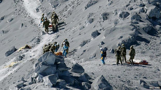 Bodies of victims brought down mountain. 28 Sept 2014