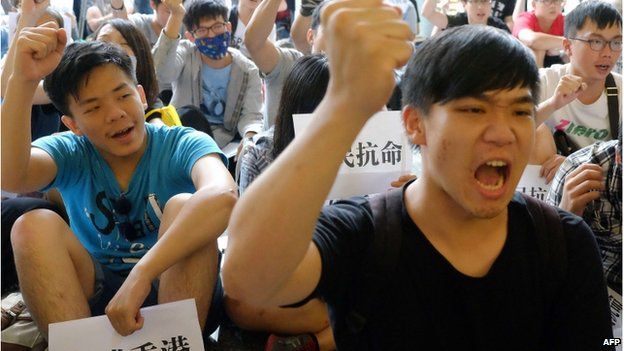 Pro-Taiwan independent students chant slogans during an anti-China demonstration at the lobby of the Hong Kong office in Taipei on 29 September 2014