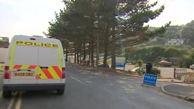 Police van at Millendreath car park.