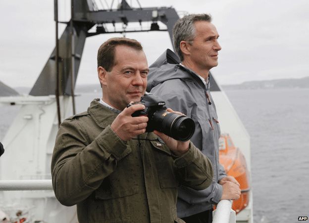Jens Stoltenberg (right) with Dmitry Medvedev on board the Helmer Hanssen research vessel just outside Kirkenes, Norway, 4 June 2013