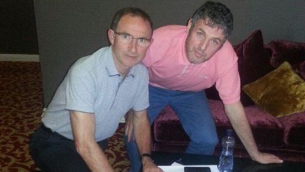 Martin O'Neill also signing Gerry's shirt (with myself