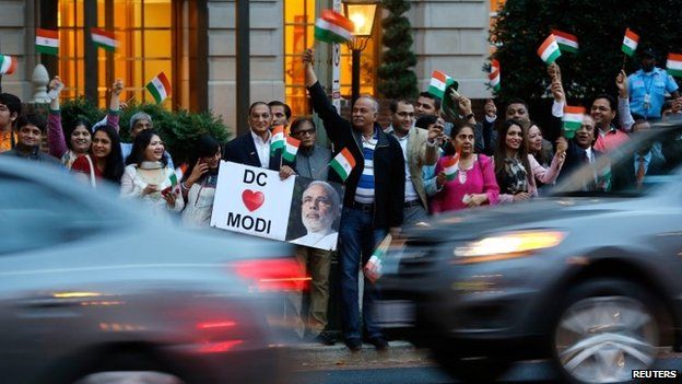 Supporters gather to greet India's Prime Minister Narendra Modi as he pays homage at the Mahatma Gandhi Statue in front of the Indian Embassy in Washington September 30, 2014.