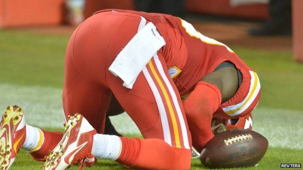 Husain Abdullah kneels in prayer