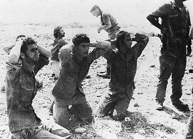 Cyprus 1974, Turkish soldiers hold Greek Cypriot prisoners.