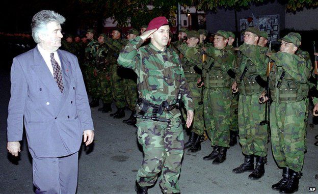 Radovan Karadzic (L) reviews the Serbian Volunteers Guard in Bijeljina (Oct. 23, 1995)