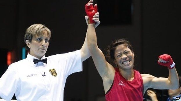 India’s MC Mary Kom celebrates as she is announced winner of the women’s flyweight (48-51kg) final boxing match against Kazakhstan’s Zhaina Shekerbekova at the 17th Asian Games in Incheon, South Korea, Wednesday, Oct. 1, 2014