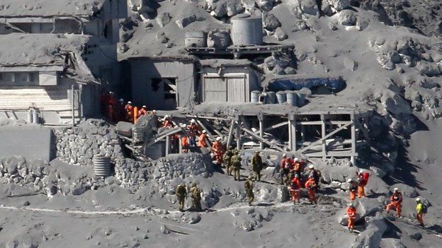 Rescue workers search for missing bodies after Mount Ontake eruption on 28 Sept