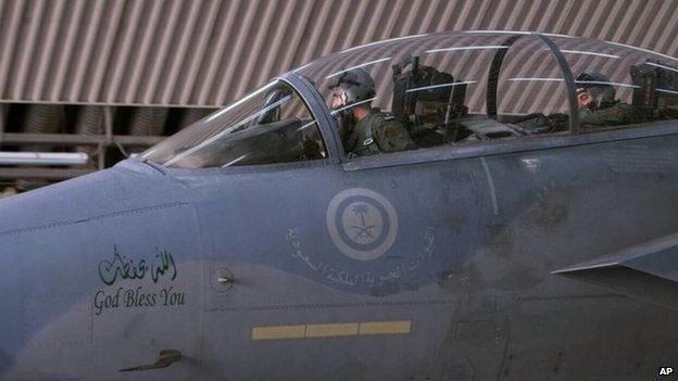 Saudi pilot inside cockpit of warplane on day of first air strikes by US-led coalition in Syria (23 September 2014)