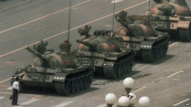 A Chinese man stands alone to block a line of tanks during the Tiananmen Square protests on 5 June 1989