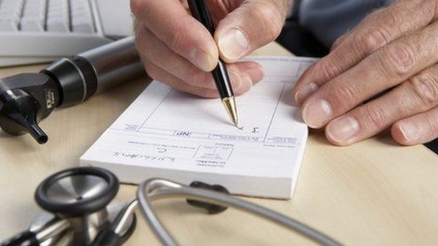 A close-up shot of a doctor writing a prescription