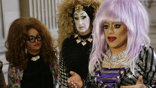 In this Sept. 17, 2014 file photo, drag queens from left, Lil Ms. Hot Mess, Sister Roma and Heklina, take turns speaking about their battle with Facebook during a news conference at City Hall in San Francisco, Calif.
