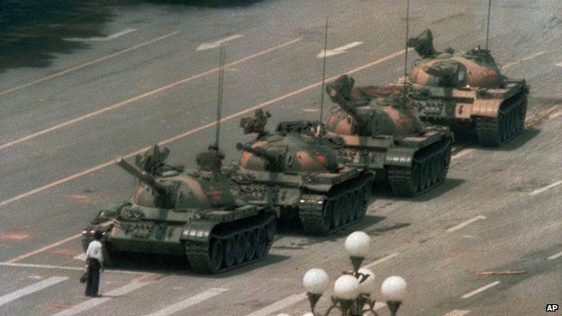 A man stands alone to block a line of tanks heading east on Beijing's Chang'an Avenue on 5 June 1989