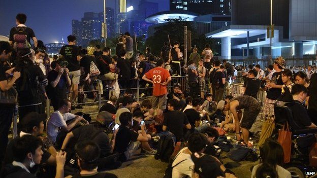 Demonstrators gather in front of embattled leader CY Leung's office in Hong Kong on October 2, 2014
