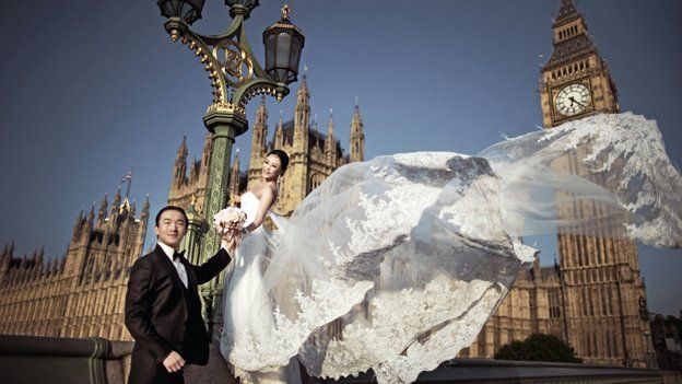 Bride and groom on Westminster Bridge