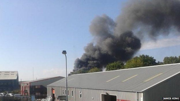 20 cars on fire at scrap metal site in Barry - BBC News