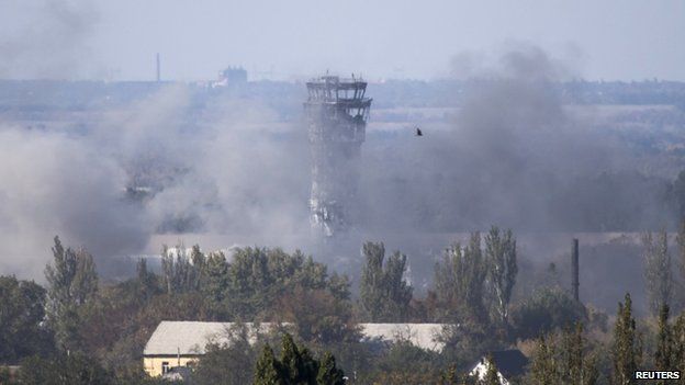 Smoke rises near the traffic control tower at Donetsk airport. Photo: 3 October 2014