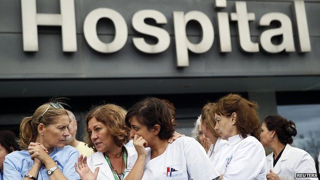 Hospital staff attend a protest outside La Paz Hospital in Madrid, Spain. 7 Oct 2014