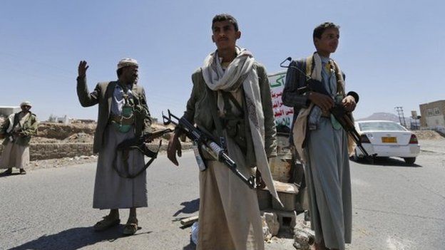 Shia Houthi rebels man a checkpoint they set up along a street in Sanaa on 21 September 2014.