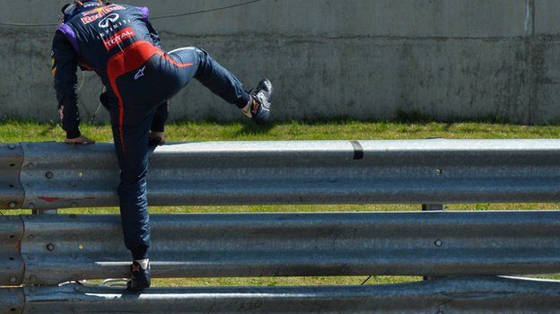 sebastian vettel jumps the Armco barrier at Silverstone