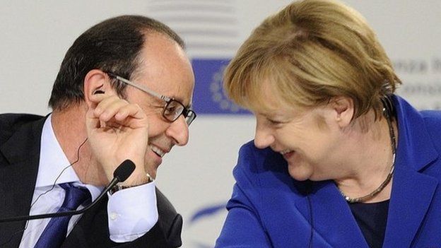 President Hollande and Chancellor Merkel chat at summit