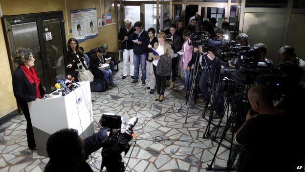 Jovanka Kostovska, left, of the Macedonian Health Ministry, speaks to the media during a news conference