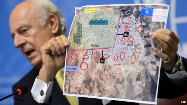 UN special envoy for Syria Staffan de Mistura shows a map of the Syrian town of Kobane during a press conference at UN office in Geneva on 10 October 2014.