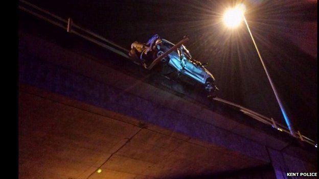 Car hanging over M26