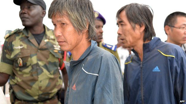 Chinese hostages, who were released after being kidnapped in raids blamed on the Nigerian Islamist group Boko Haram, arrive in Yaounde on 11 October 2014.