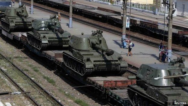 A freight car loaded with self-propelled howitzers is seen at a railway station in Kamensk-Shakhtinsky, Rostov region, near the border with Ukraine, 23 August 2014