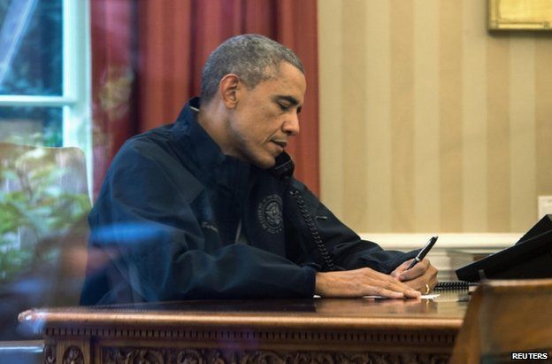 US President Barack Obama speaks by phone from the White House to US Health and Human Services Secretary Sylvia Burwell about the Ebola response, 12 October