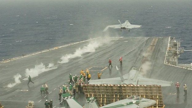 Planes takes off from USS George Washington