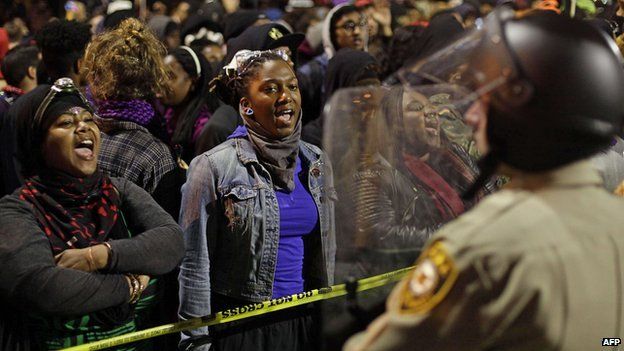 Protesters and police in Ferguson