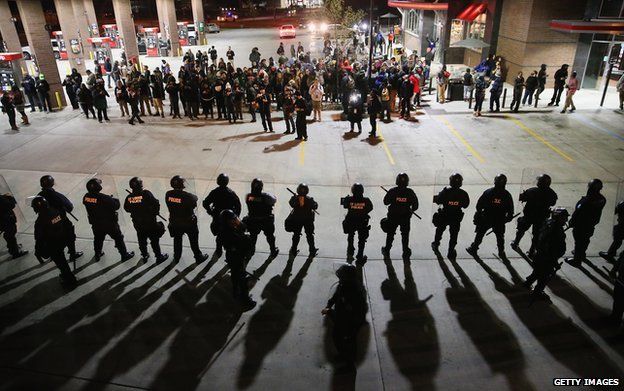 Protestors and riot police in Ferguson