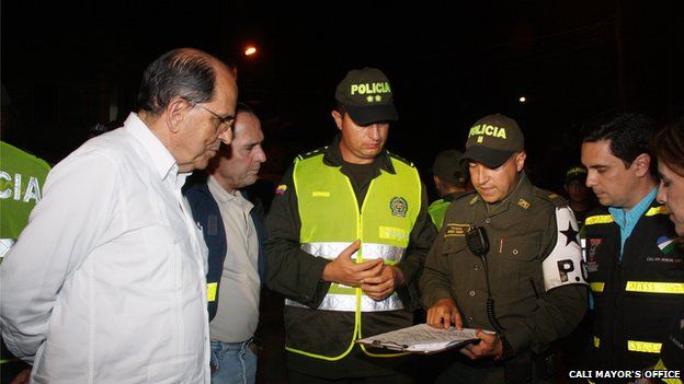 Mayor of Cali Dr Rodrigo Guerrero with police officers in the city of Cali