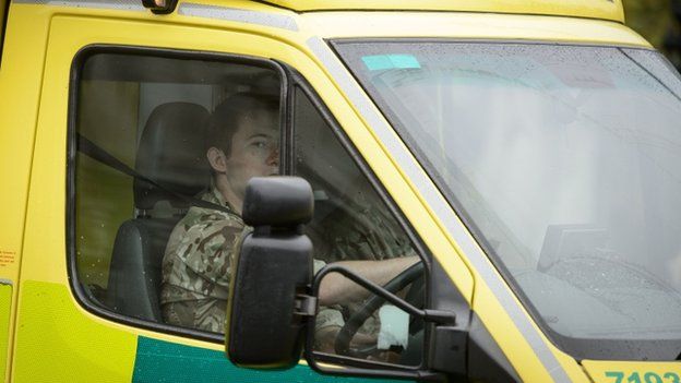 A member of military driving a London ambulance