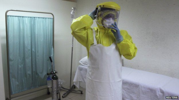 A health worker uses a protective suit during a presentation for the media at the international airport in Guatemala City 13 October 2014.