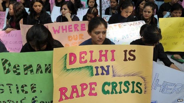Women from India's North Eastern states hold placards during a peaceful protest against the rape of a girl from Mizoram, in New Delhi on November 29, 2010