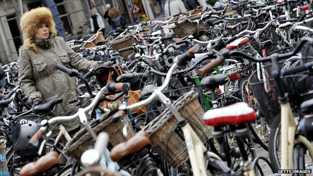 Cyclist with bicycle in Copenhagen