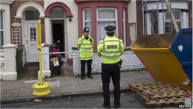 Police officers outside a house in Portsmouth