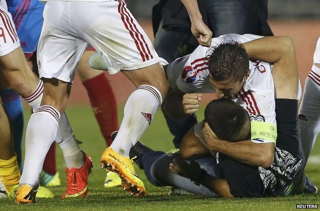Albania players brawl with Serbia fans at the stadium in Belgrade, 14 October