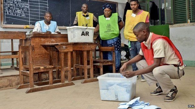 Election officials in Mozambique count votes at a polling station in Maputo - 15 October 2014