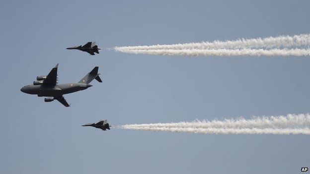 Indian Air Force"s C-17 Globemaster III, center, with Sukhoi Su-30MKI flies in formation whiles displaying aerial demonstration during Air Force Day at the air force station in Hindon near New Delhi, India, Wednesday, Oct. 8, 2014.