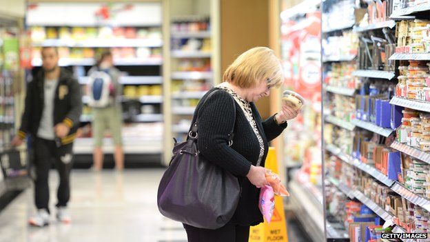 A woman shops in a supermarket in Sydney on 23 April, 2014