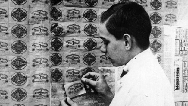 man using banknotes as wallpaper