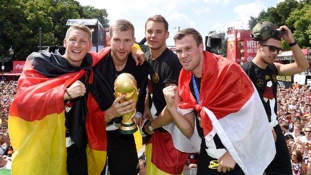 German football players holding trophy