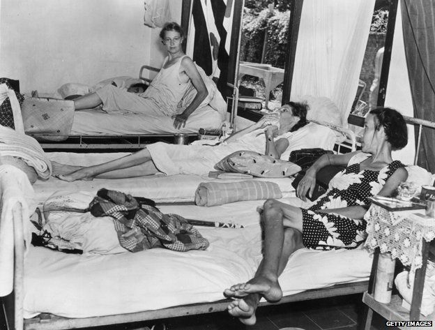 December 1945: Three female inmates in the hospital of the Tjideng internment camp on Java, Indonesia, suffering from dysentry and malnutrition.